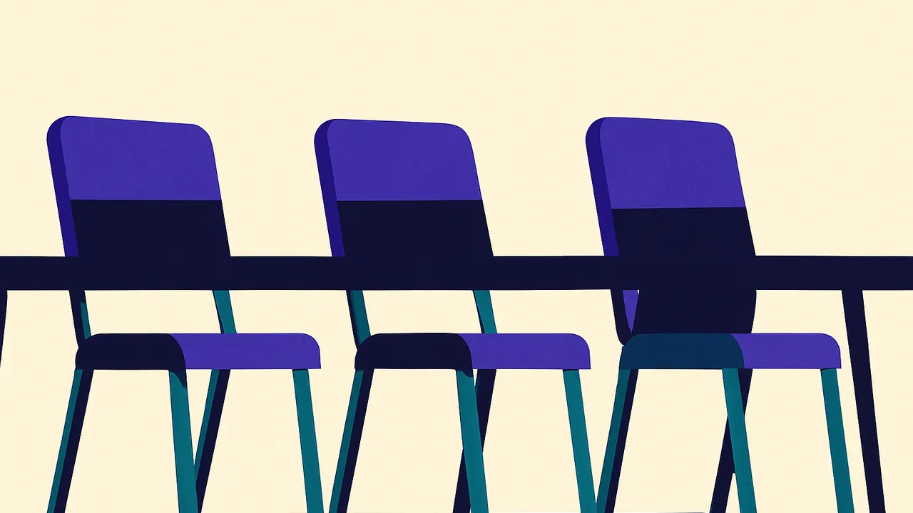 three empty chairs at a long conference table, pushed back from their places